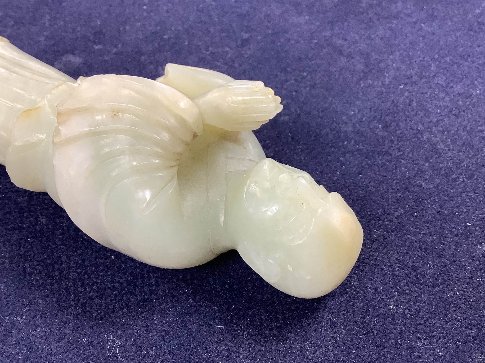 A Chinese celadon jade figure of a priest